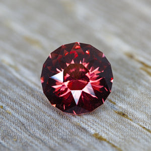 1.52 ct Precision-Cut Malaya Garnet – "Olivera" Round Brilliant