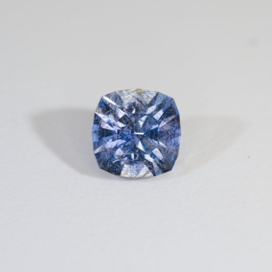 Cushion cut Icy Sky Blue Sapphire with Rose Channels on white background