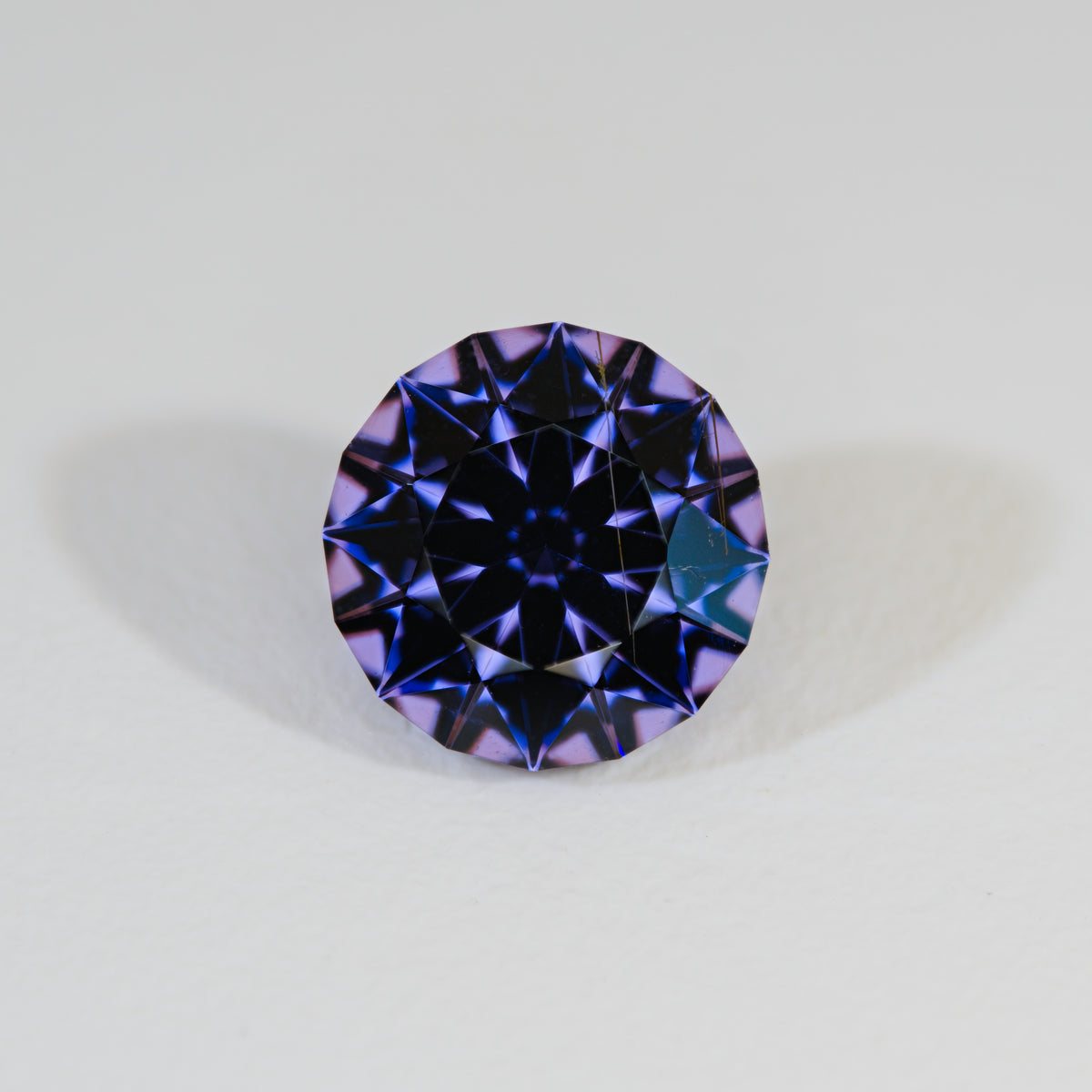 Spinel Tunduru Vivid Blue Purple Color Shift Precision Round Brilliant on white background